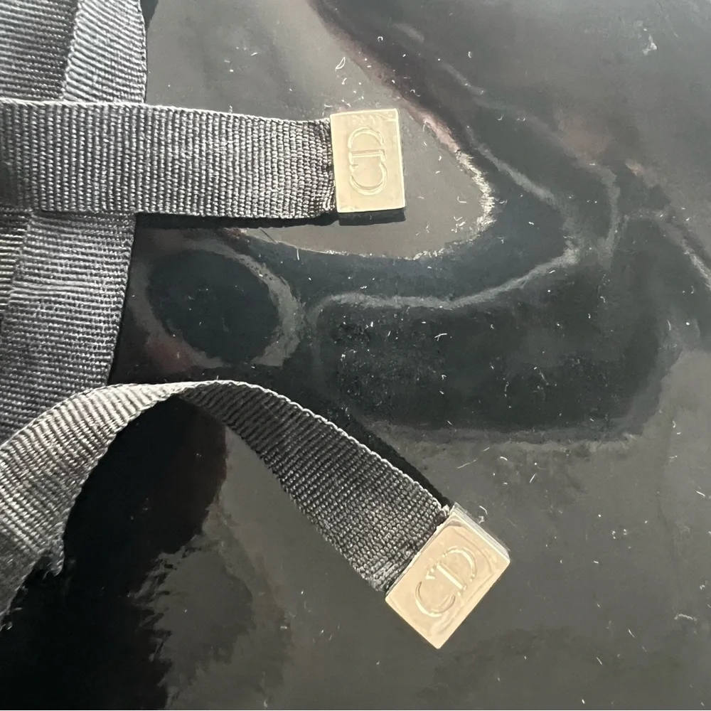 Dior Glossy Black Makeup Bag with Ribbon Detail.
